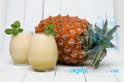 Fresh Pineapple Juice Isolated On A White Background Stock Photo