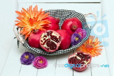 Fresh Pomegranate Fruits Isolated On A White Wooden Background Stock Photo