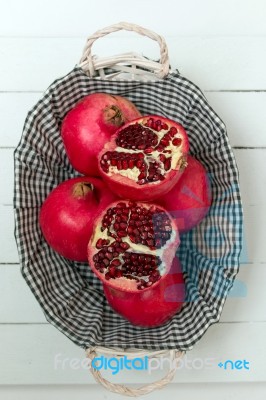 Fresh Pomegranate Fruits Isolated On A White Wooden Background Stock Photo