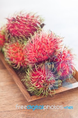 Fresh Rambutans On Wodden Tray Stock Photo