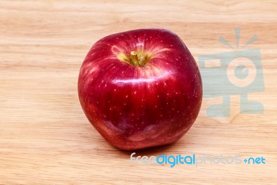 Fresh Red Apple On Wood Background Stock Photo