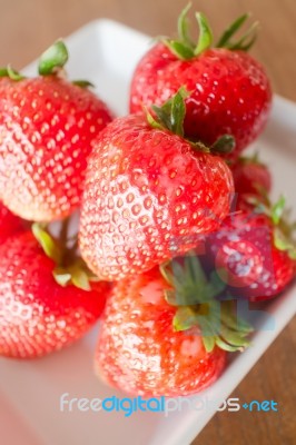 Fresh Ripe Strawberries On White Plate Stock Photo