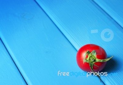 Fresh Tomatoes On The Blue Wooden Table Stock Photo