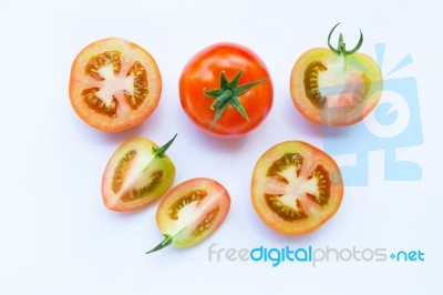 Fresh Tomatoes On White Wooden Background Stock Photo