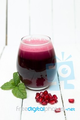 Fresh Tropical Pomegranate Juice Isolated On A White Background Stock Photo