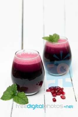 Fresh Tropical Pomegranate Juice Isolated On A White Background Stock Photo