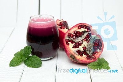 Fresh Tropical Pomegranate Juice Isolated On A White Background Stock Photo