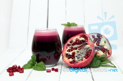 Fresh Tropical Pomegranate Juice Isolated On A White Background Stock Photo