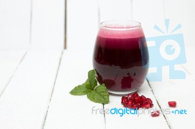 Fresh Tropical Pomegranate Juice Isolated On A White Background Stock Photo