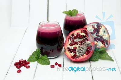 Fresh Tropical Pomegranate Juice Isolated On A White Background Stock Photo