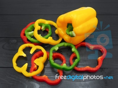 Fresh Vegetables, Red, Yellow, Green Sweet Peppers On Dark Wood Stock Photo