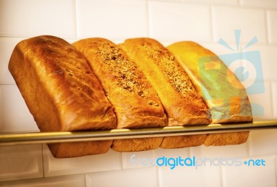 Freshly Kneaded Grain And White Breads For Sale Stock Photo