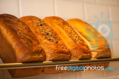 Freshly Kneaded Grain And White Breads For Sale Stock Photo