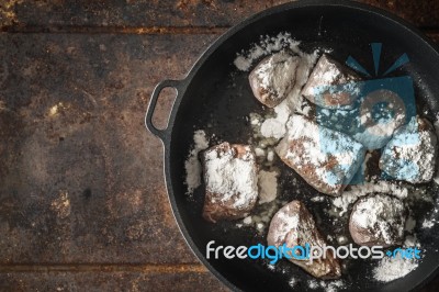 Fried Angus Beef With Flour In The  Pan Top View Stock Photo