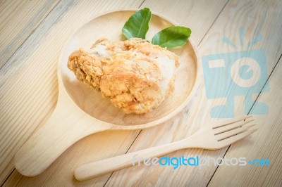 Fried Chicken In Batter  On A Wooden Background Stock Photo