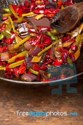 Fried Chili Pepper And Vegetable On A Wok Pan Stock Photo