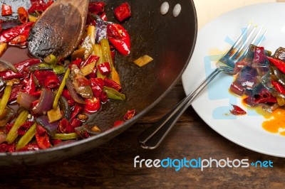 Fried Chili Pepper And Vegetable On A Wok Pan Stock Photo