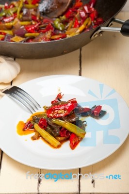 Fried Chili Pepper And Vegetable On A Wok Pan Stock Photo