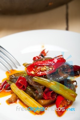 Fried Chili Pepper And Vegetable On A Wok Pan Stock Photo