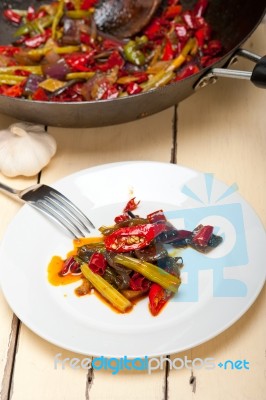 Fried Chili Pepper And Vegetable On A Wok Pan Stock Photo