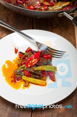 Fried Chili Pepper And Vegetable On A Wok Pan Stock Photo