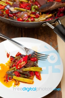 Fried Chili Pepper And Vegetable On A Wok Pan Stock Photo