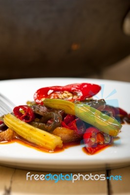 Fried Chili Pepper And Vegetable On A Wok Pan Stock Photo