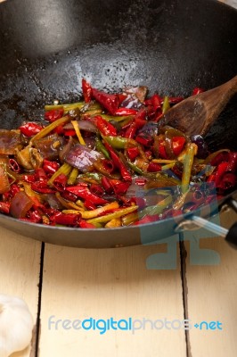 Fried Chili Pepper And Vegetable On A Wok Pan Stock Photo