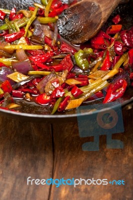 Fried Chili Pepper And Vegetable On A Wok Pan Stock Photo