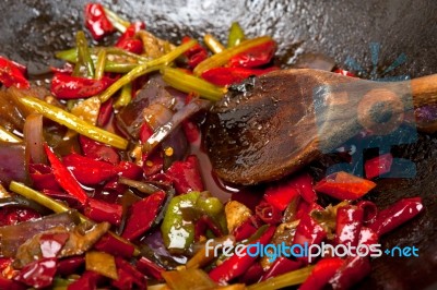 Fried Chili Pepper And Vegetable On A Wok Pan Stock Photo