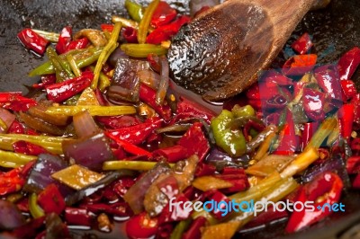 Fried Chili Pepper And Vegetable On A Wok Pan Stock Photo