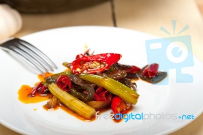 Fried Chili Pepper And Vegetable On A Wok Pan Stock Photo