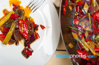 Fried Chili Pepper And Vegetable On A Wok Pan Stock Photo