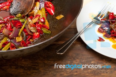 Fried Chili Pepper And Vegetable On A Wok Pan Stock Photo