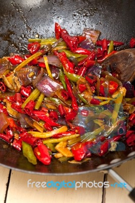 Fried Chili Pepper And Vegetable On A Wok Pan Stock Photo