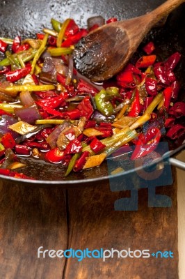 Fried Chili Pepper And Vegetable On A Wok Pan Stock Photo