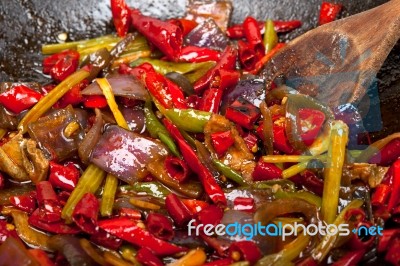 Fried Chili Pepper And Vegetable On A Wok Pan Stock Photo