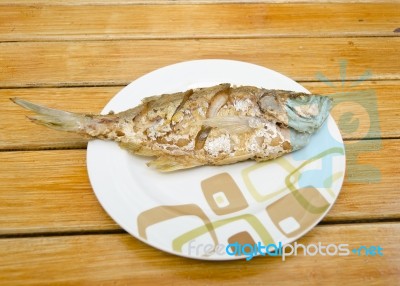 Fried Fish On  Wood Background Stock Photo