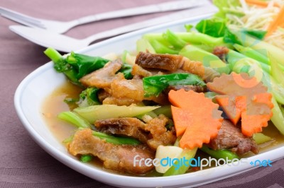 Fried Kale With Crispy Pork Stock Photo