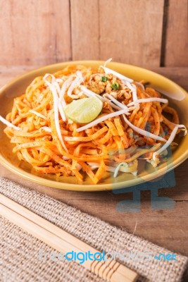 Fried Rice Noodles Topped With Pork Stock Photo