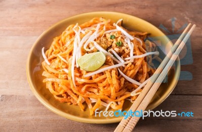 Fried Rice Noodles Topped With Pork Stock Photo