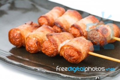 Fried Sausage Rolled With Bacon Stock Photo