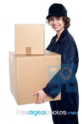 Friendly Delivery Woman In Uniform Stock Photo