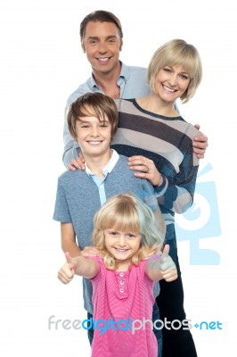 Friendly Family Of Four In The Studio Stock Photo