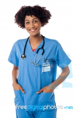 Friendly Female Doctor Smiling Isolated Over White Stock Photo