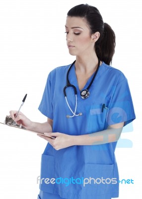 Friendly Nurse Making Medical Notes Stock Photo