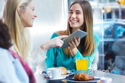 Friends Having Fun With A Digital Tablet Stock Photo