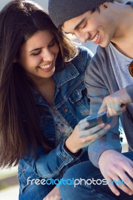 Friends Having Fun With Smartphones Stock Photo