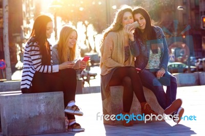 Friends Having Fun With Smartphones Stock Photo