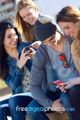 Friends Having Fun With Smartphones Stock Photo